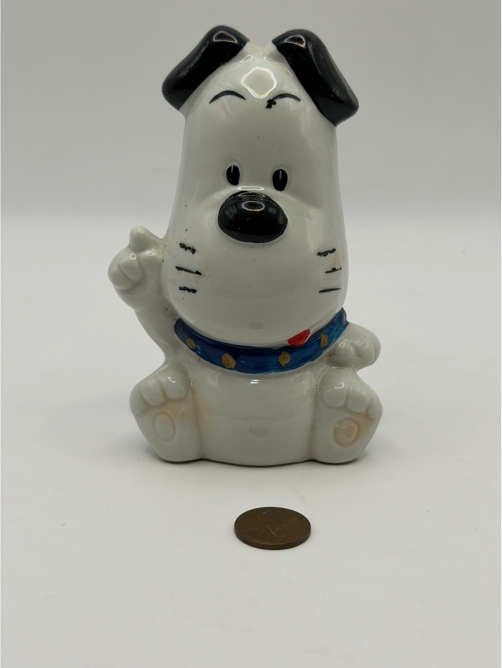 Ceramic dog figurine.